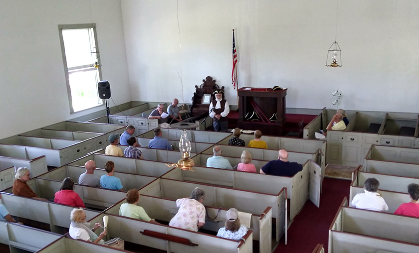 Biddeford Historical Society President Dana Peck reading the Declaration of Independence aloud at the Meetinghouse